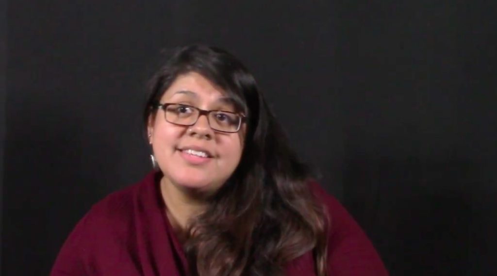 A mother smiling during a filmed interview