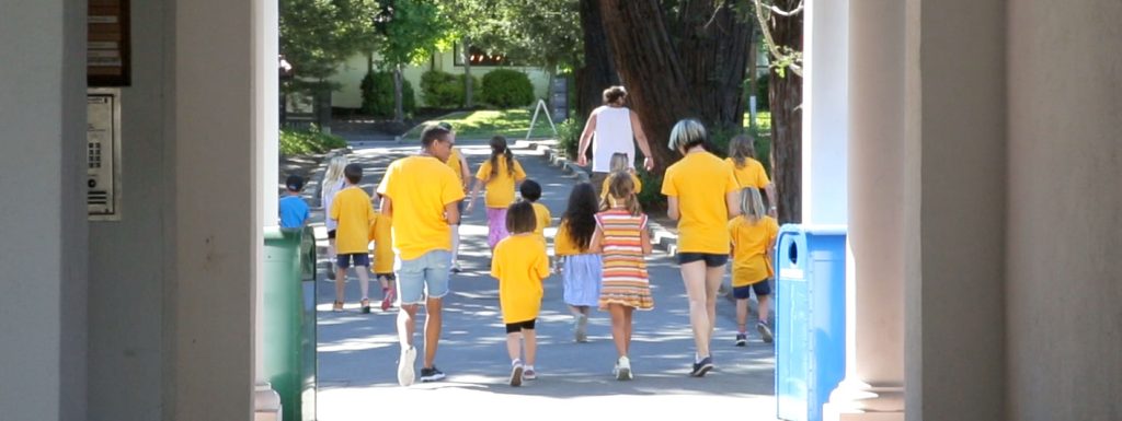 A group of children and camp leaders walking together